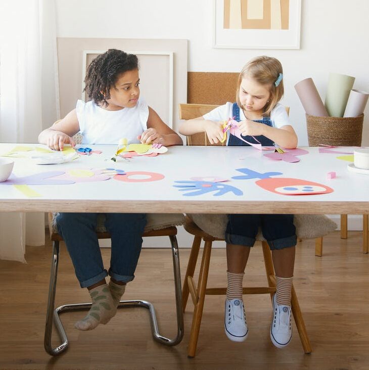 two kids doing some artworks